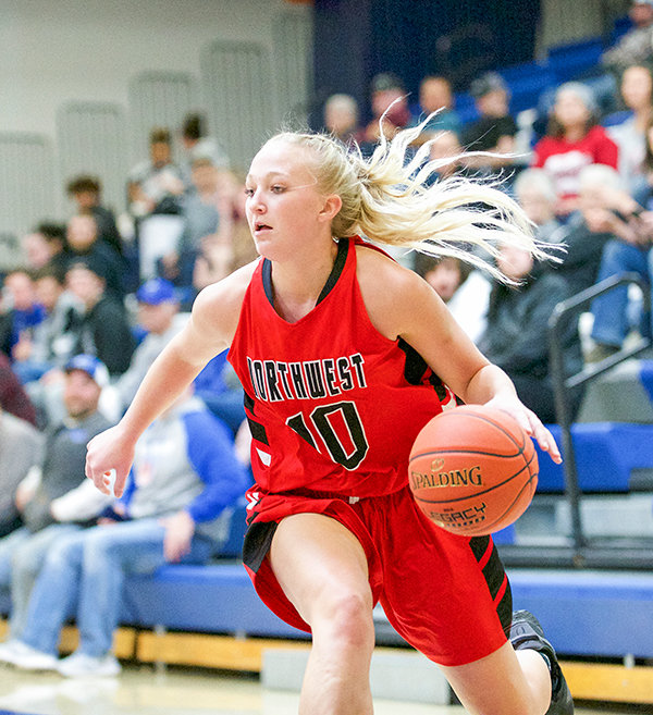 NWC freshman Brenna Rouane drives baseline during the Trappers matchup against Miles CC. The Trappers found their groove in the second quarter en route to a 23 point victory and a 2-1 road trip in Montana.