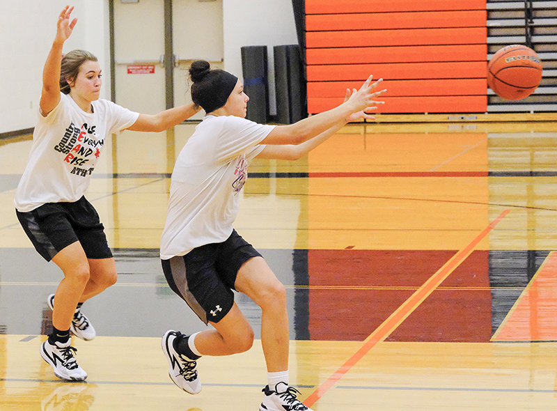 Maddie Campbell (left) goes out to defend Caitlynn Floy (right) as the Panthers worked to get open out of the post at the start of a Nov. 23 practice. The Panthers plan to rely on their speed as they head into the new season.