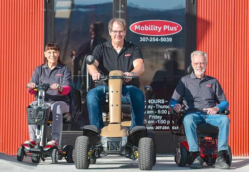 Jackie Vaiskauskas, Chris Pelletier and Ed Vaiskauskas show off some of the new models of scooters available at the Mobility Plus franchise in Ralston next door to Pelletier’s Heart Mountain Hearing Center.