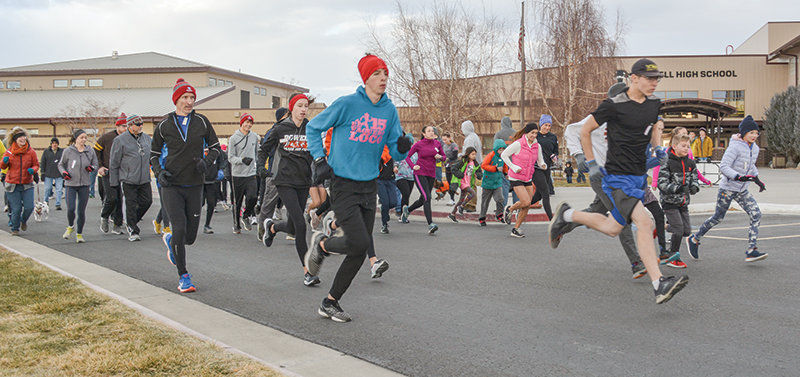 Runners take off from Powell High School as part of the Turkey Trot on Thanksgiving Day. The holiday event raised money for the PHS Robotics Club and featured a 5K and 1-mile run/walk.