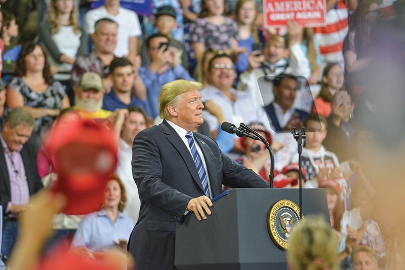 Then-President Donald Trump addresses a crowd of supporters during a 2018 rally in Billings, Montana. Trump is expected to host a rally in Wyoming in May to help campaign against U.S. Rep. Liz Cheney, R-Wyo., who’s been a frequent critic of the former president.