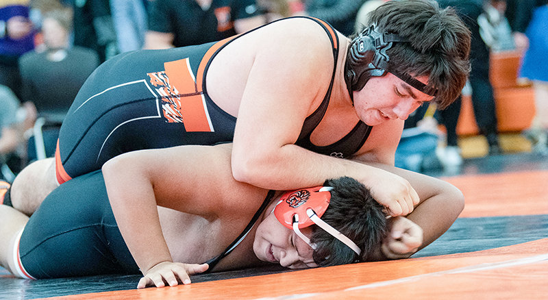 PHS sophomore Adam Flores pins down Bryan Escobar during his opening match at the Powell Invitational on Friday, Dec. 10. Flores finished second at the meet, which featured stiff competition for the young Panther team.