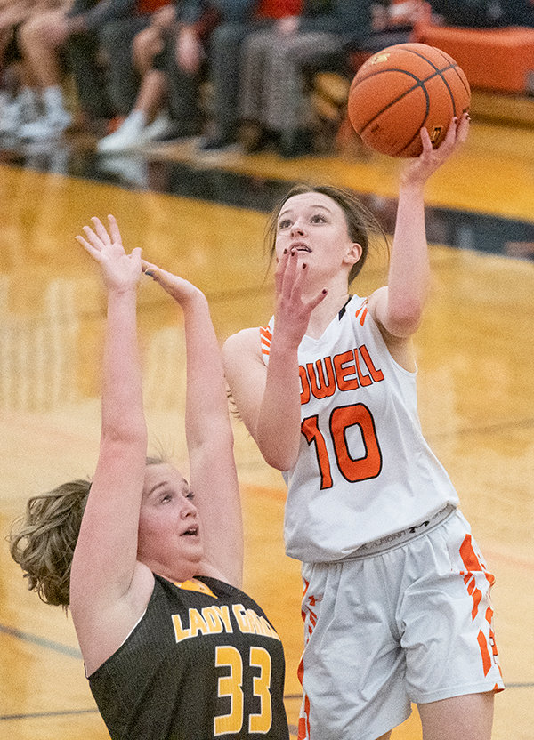 PHS sophomore Waycee Harvey finishes with the left hand over a Rocky Mountain defender. The Panthers battled to an overtime loss to the Grizzlies, 48-42, on Saturday.