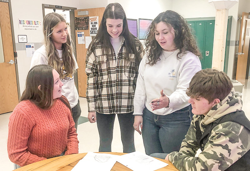 Powell High School students Allison Morrison, Jordyn Dearcorn, Gracie Trotter, Lilly Morrison and Stetson Davis discuss plans for a greenhouse they’re designing. The students, who are in Wendy Smith’s science classes, were named Wyoming state winners in the Samsung Solve for Tomorrow Contest. Not pictured are Steven Stambaugh, Katie Beavers and Simon Shoopman.