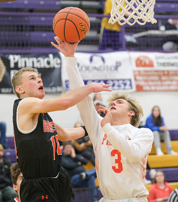 PHS senior Keaton Rowton puts up a layup against a Burlington defender during their matchup on Friday night. The Panthers went 3-1 during the Big Horn Basin Classic in Thermopolis, falling in the championship game against Worland.
