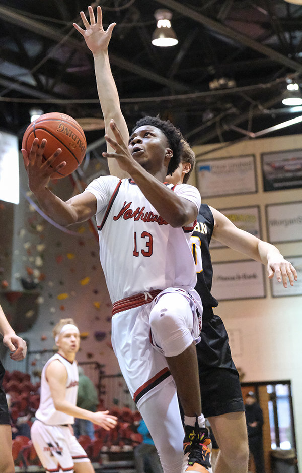 Trapper sophomore Oluwaseyi Oyeku tries to finish with the right hand as a trailing Lancer defender goes for a block. The Trappers started 2022 shooting cold, dropping their fourth consecutive game on Saturday to Eastern Wyoming.