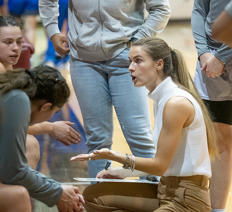 First-year Tapper head coach Lauren Davis tries to motivate her team during a time out against Miles City on Jan. 14. At 10-9, Davis and the Trappers have their first winning record of the season after a 1-5 start.