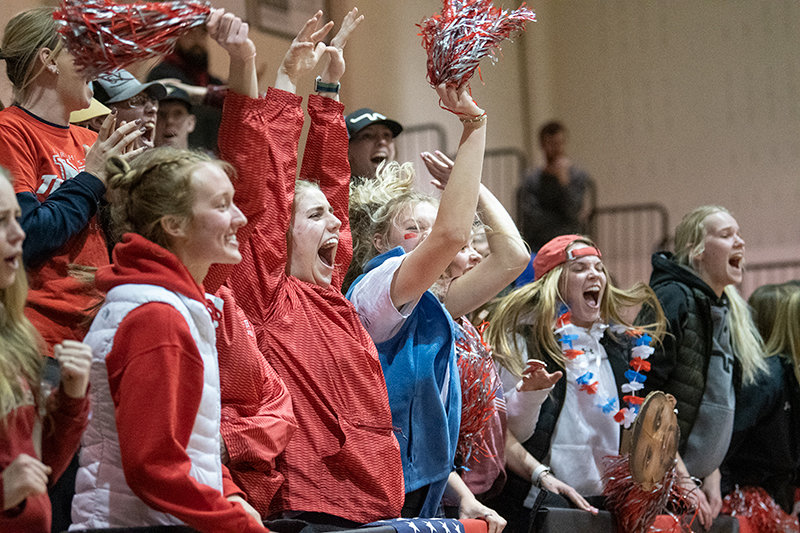 The Trapper student section celebrates a 3-point bucket in the final minute of play Monday evening, moving NWC closer to the win.