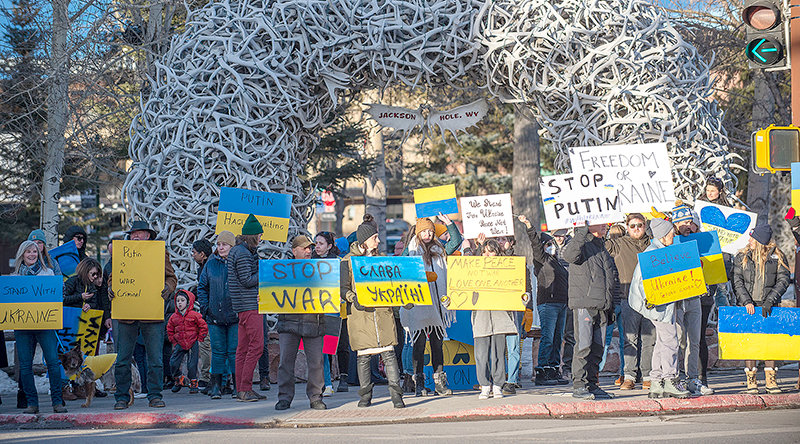 Protesters, including several native Ukrainians, gather at the Town Square in Jackson on Monday to show solidarity with Ukraine. Sleeping Giant Ski Area near Cody, is hosting a Saturday fundraiser for Ukraine and owner Nick Piazza is facilitating several volunteers heading to fight in the new Ukrainian Foreign Legion and work alongside neighborhood watch groups.