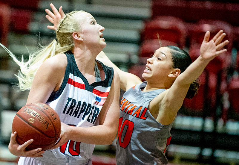 NWC forward Brenna Rouane tries to finish through contact against a Central Wyoming defender during a Feb. 26 play-in game. The Trappers’ season wrapped up last week with a loss to Western Nebraska.