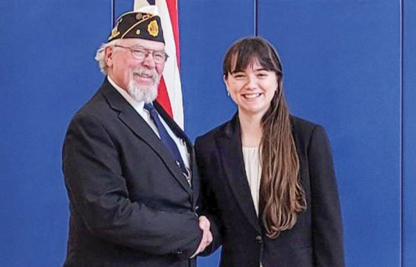 Powell High School junior Emma Johnson poses for a photo with Donald York, chairman of the American Legion Department of Wyoming’s Oratorical Scholarship Committee, after winning the legion’s state oratorical contest.
