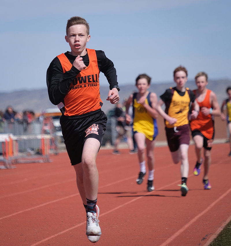 Eighth grader Korbyn Warren runs ahead of the pack en route to a second place finish in the 1600. He also took third in the 800 and was part of the winning 4x400 relay team on Saturday in Powell.