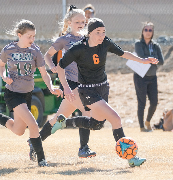 Cubs forward Ivy Agee pushes the ball upfield early during their game against Worland on Thursday, April 7. The Cubs defeated Worland 7-0 and Rawlins 9-1 on Saturday to start their season strong.