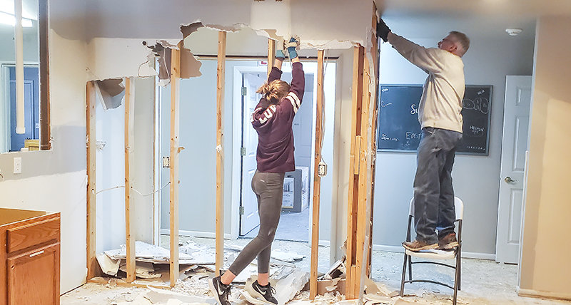 Charity Siggins and Doug Siggins work to remodel the former Northwest Wyoming Treatment Center into a home.