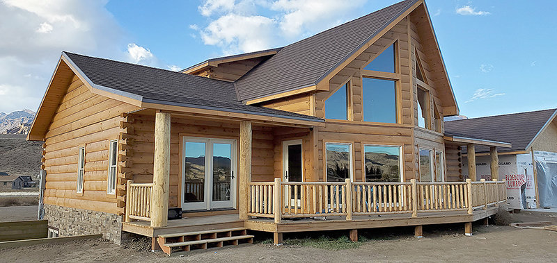 Brown built this 5,000 square-foot log home in Wapiti. He said they waited nine months for the log siding to complete the garage. They hope to have the house completed by mid-May.
