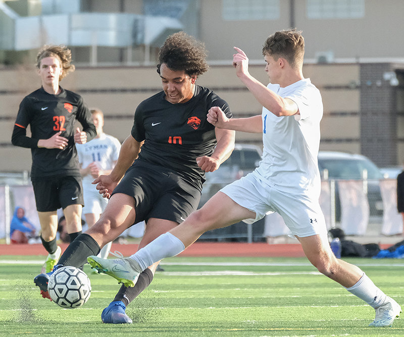 Helping contribute to a dominant weekend, PHS senior Kaleb Brown (center) pushed the pace up the right wing — swinging the ball to his teammates as the Panthers cruised to a 12-1 victory over Lyman on Thursday and a 14-0 victory over Mountain View on Friday.