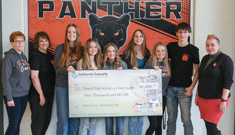 The Panther cheer team poses with a check from California Casualty after receiving a Thomas R. Brown Athletics Grant. Pictured from left: Cindy Jacobs, Vicki Walsh, Kate Miller, Sophia Petrie, JJ Gardner, Maggie Atkinson, Morgan Schmidt, Kolby Crichton and Jenny Gardner from the Wyoming Education Association.