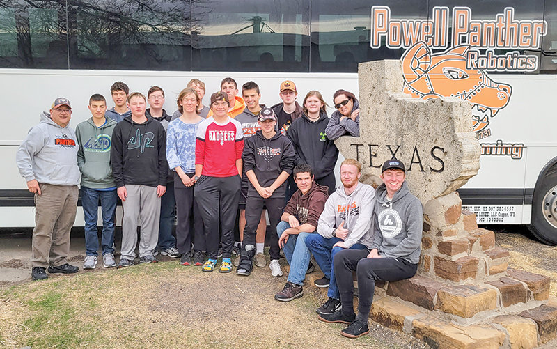 Powell High School robotics teams The Mad Hatters, Squiggle Splat Bang and Rapid Unscheduled Disassembly stand by their charter bus on the way to the FIRST Championship in Houston in April. Back row, from left: Ethan Bartholomew, Jacob Harms, Dallin Waite, Daniel Merritt, Alan Crawford, Gus Miller, Brianna Evelo and Lenita Moore. Front row, from left: Joel Hayano, Phillip Ellis, Isaac Stensing, Gabe Rose, Dexter Opps, Brianna Evelo, Sam Childers, David Polson, Francis Rogers and Kalin Hicswa.