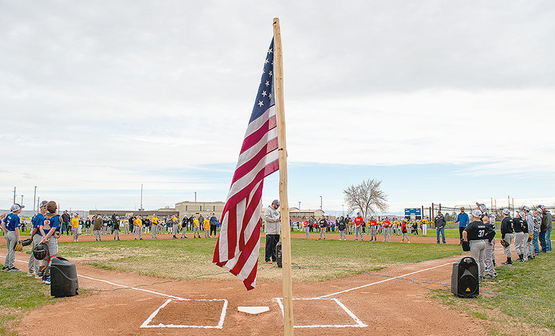 Powell Little League president Travis Jones introduces Powell’s 21 teams at Homesteader Park Saturday. Dave Fink threw out the ceremonial first pitch to start the summer season.