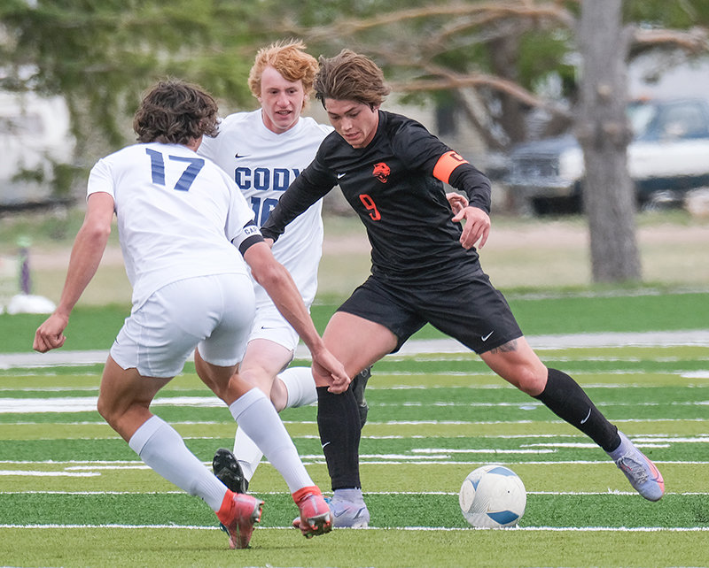 Looking for one last victory against rivals Cody, senior Hawkin Sweeney pushes the ball up the field on Saturday in the third place game in Cheyenne. Sweeney finished with the second most goals in class 3A this season.