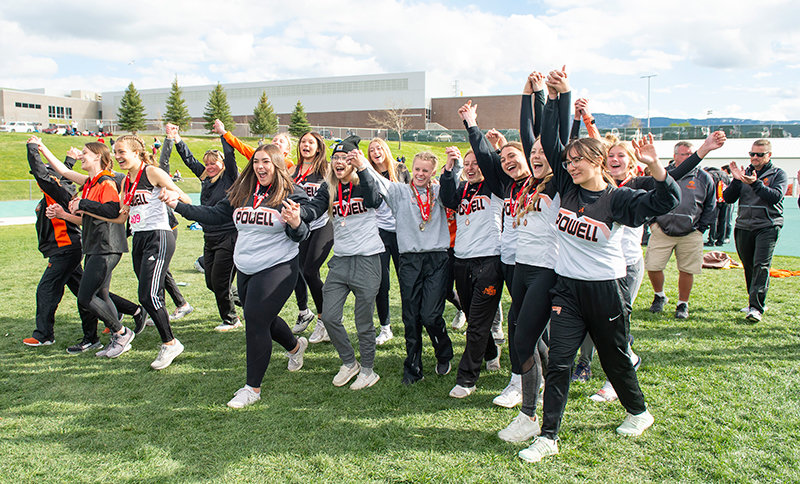 Celebrating a second consecutive championship, the Panther girls' track team joined hands before walking to receive the team trophy and begin the celebrations.