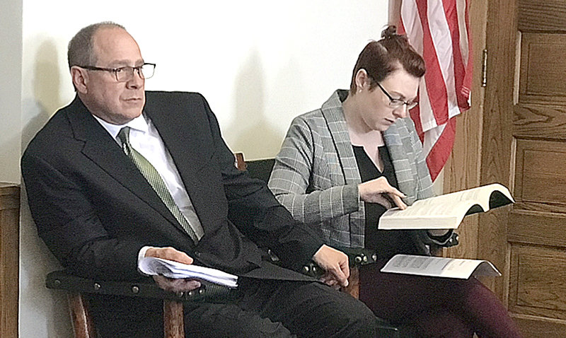 County attorney Bryan Skoric and deputy attorney Mallory Riley read over a book of Wyoming statutes during the Park County commissioners meeting on May 17.