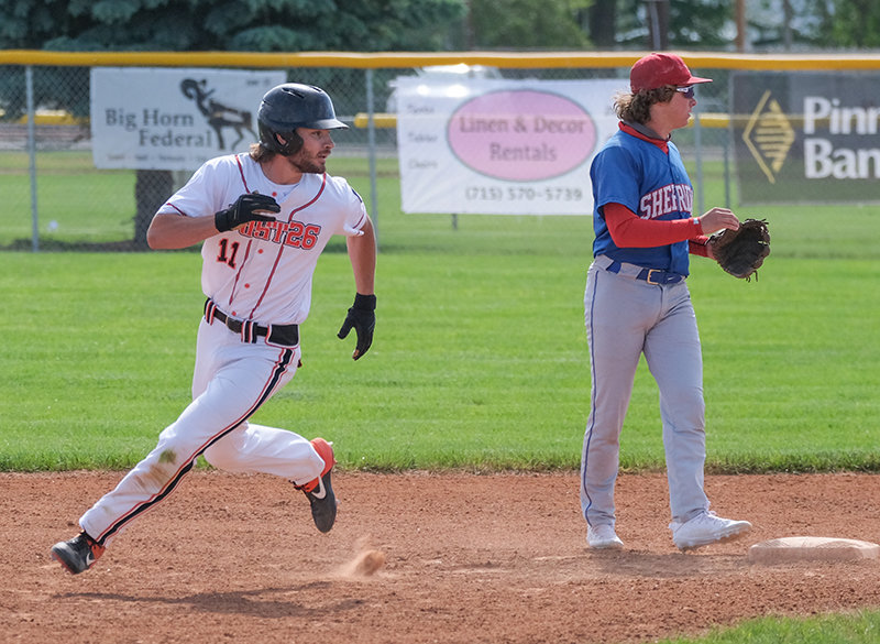 Nathan Feller looks behind him as he rounds second base searching for the ball that got past on an errant throw. Feller scored on the play. The Pioneers have a couple of days to rest and prepare before starting the Father’s Day Tournament on Friday.