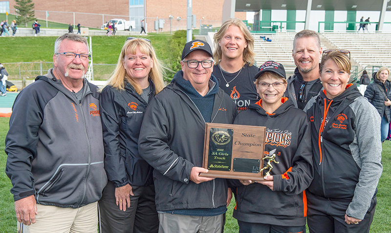 A successful season ended in a state championship and additional honors for the Panthers’ coaching staff as they posed with the trophy following the state meet in May. From left: Nevin Jacobs, Tracy McArthur, Scott Smith, Sean Munger, Shelley Heny, Dan Hunter and Ashley Hildebrand.