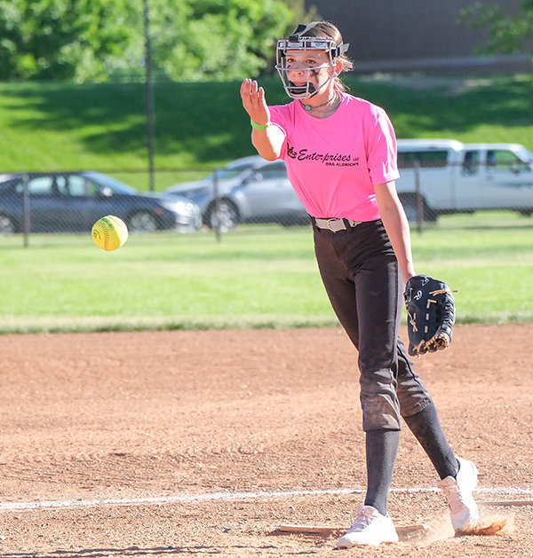 Kindyle Floy releases a pitch as the two Powell softball teams clashed on Tuesday last week. Floy and her team went on to place third overall in the tournament competing against Lovell, Powell and Cody.
