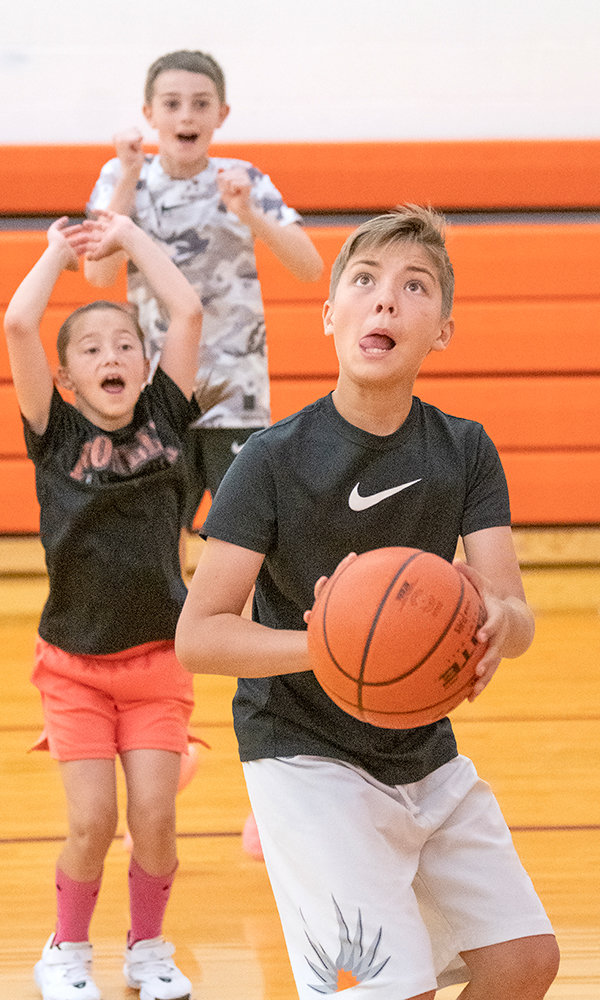 Kamea Wisniewski gets ready to put up a shot while being cheered on by fellow campers.