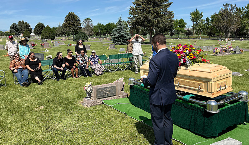 Zachary Thompson, of Thompson Funeral Home, officiates the graveside services for Sally Montoya Saturday at Crown Hill Cemetery.