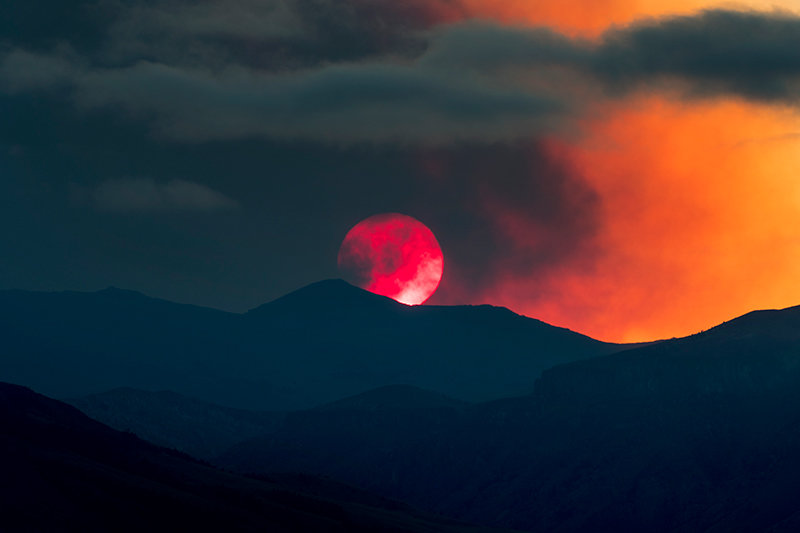Smoke obscures the sun as it shines on the Absaroka Mountain Range in 2018, one of the worst fire seasons in the past five years. Smoke from fires in the West this year has now made it to the Big Horn Basin.