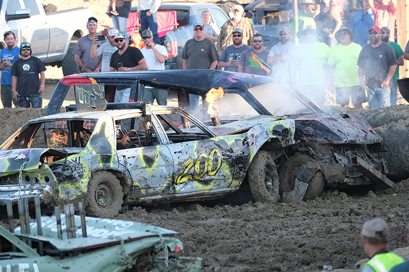 Robby Brown crashes into the side of Wyatt Peterson’s van during the chain-up derby on Saturday.