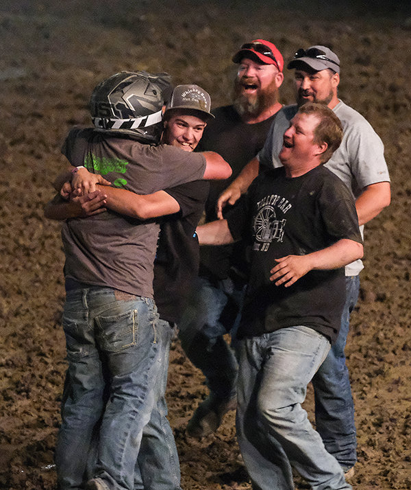 Friends and family rush to hug Trent Gillett after he took home the top prize of $3,500 in the limited weld final.
