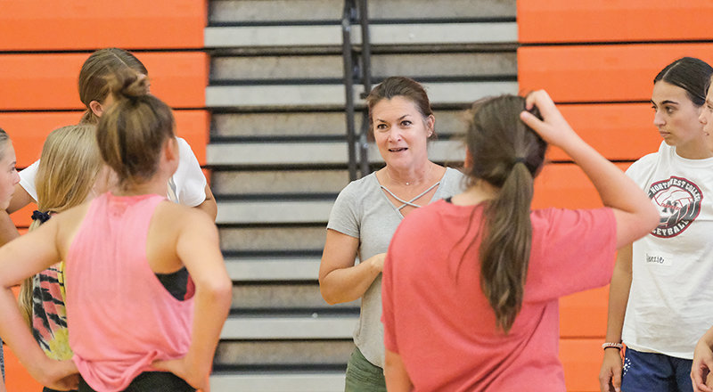 PHS volleyball coach Lesli Spencer gives advice to campgoers at the end of the evening session on Tuesday.