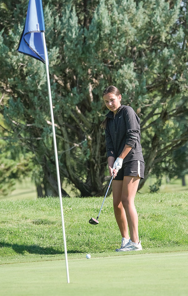 Freshman Coy Erickson watches her putt head towards the cup, joining the Panther golf team as the only girl competing for PHS through the first week of the season. The Panthers home tournament starts today (Thursday) at 1 p.m. at the Powell Golf Club.
