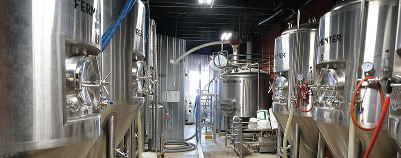 WYOld West Brewery houses their brewing equipment to the left of the entryway. Briess Malt and Ingredients Company employees are proud to see that their product goes into the beer when they enter the building.