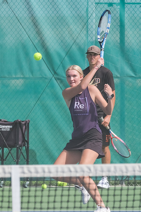 PHS senior Sydney Hull returns a shot during practice on Friday. Hull expects to be in the mix at the top for the Panthers as the Powell girls’ tennis team returns a wealth of experience.
