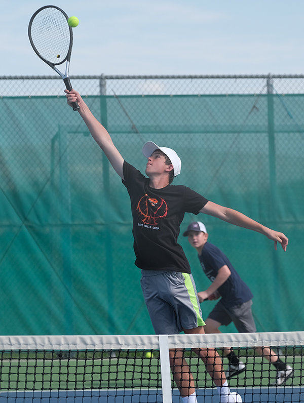 Freshman Taeson Schultz reaches up for a high shot at the net during practice on Friday. The Panthers will have numerous athletes stepping into bigger roles this season after graduating the top four players last year.