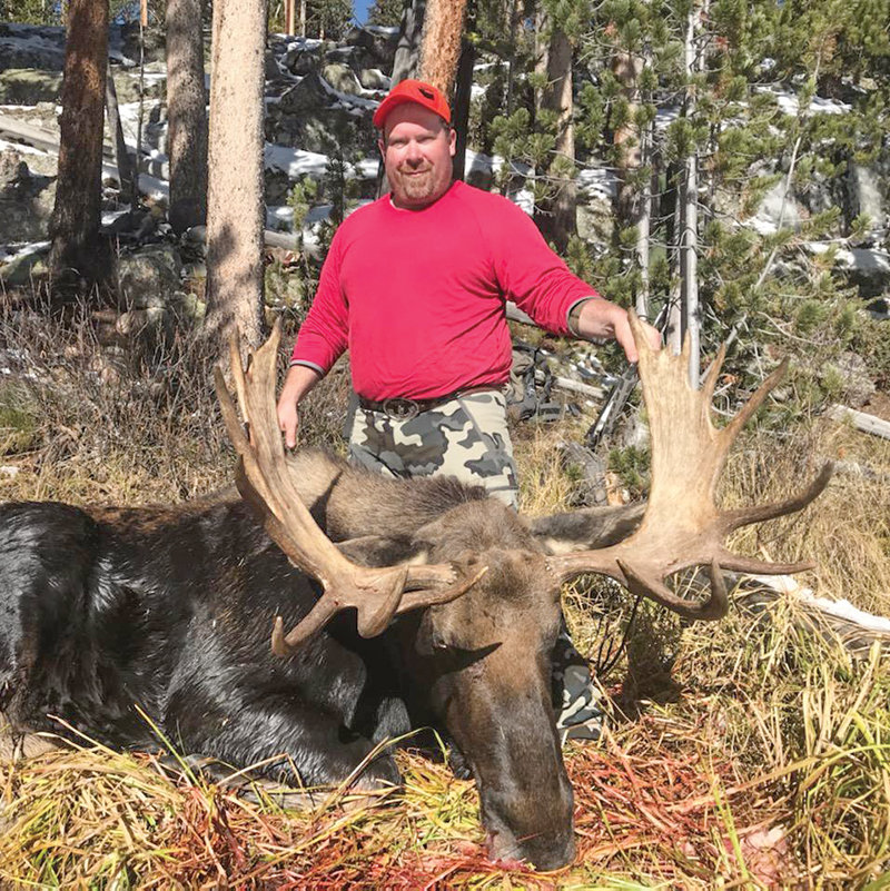 Ryan Muecke with a moose he harvested. Not only does the family hunt together, they also enjoy spending the colder months ice fishing and harvesting game birds when in season.