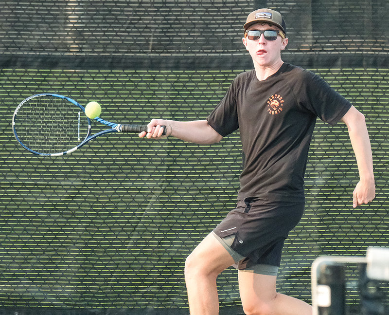 Keegan Hicswa (first photo) and Kalin Hicswa (second photo) both return shots during the Panthers final matchups against Cody on Sept. 12. The brothers head to the state tournament to compete at No. 1 doubles this weekend.