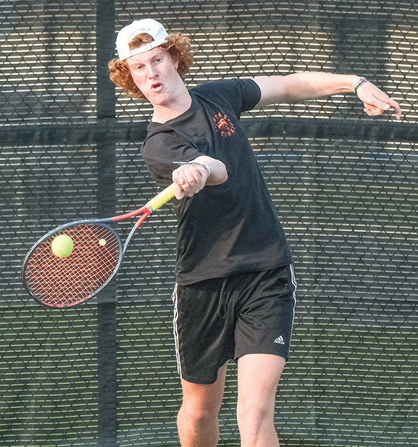 Keegan Hicswa (first photo) and Kalin Hicswa (second photo) both return shots during the Panthers final matchups against Cody on Sept. 12. The brothers head to the state tournament to compete at No. 1 doubles this weekend.
