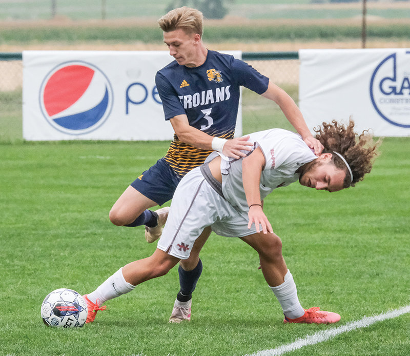 Benjamin Lachaize holds off a Trinidad defender in a home matchup earlier this season. Lachaize and the Trappers head to Casper on Saturday to try and upset No. 20-ranked Casper College.