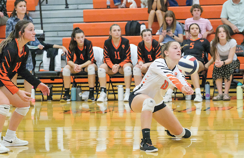 PHS sophomore libero Alexa Richardson (right) digs a ball while teammate, senior Mikayla Graham, waits in anticipation for the next play. Powell heads to Lander for the 3A West Conference Duals this weekend.