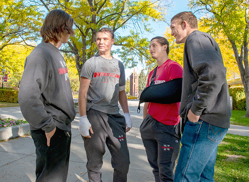 (Left to right) Trapper wrestlers August Harrison, Kendell Cummings, Brady Lowry and Orrin Jackson get a moment to themselves on campus Wednesday between media interviews. The students now have a bond for life after surviving a grizzly bear attack Saturday in the Absaroka Mountains in the Shoshone National Forest.