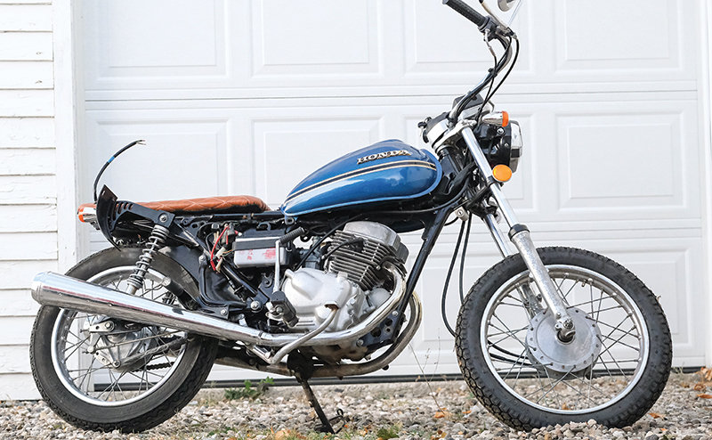 This Honda Twinstar has been significantly altered in comparison to the original model which featured upright handlebars, extended turn signals and oversized crash bars.