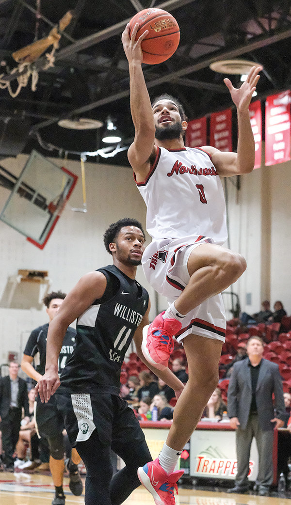 Milton Rodriguez Santana finishes off the fast break against Williston State on Monday. The Trappers have continued their hot start to a 5-1 record early in the season.