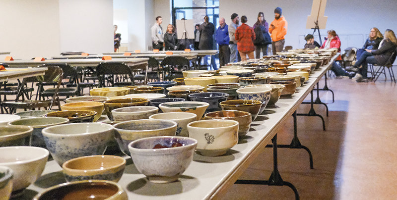 People were already lined up in The Commons an hour before the annual Empty Bowls fundraiser put on by Northwest College professor Elaine DeBuhr, whose pottery students made 500 bowls to be given to attendees to each one of three soup varieties at the event. All proceeds from the event go to support the Loaves and Fishes food bank.