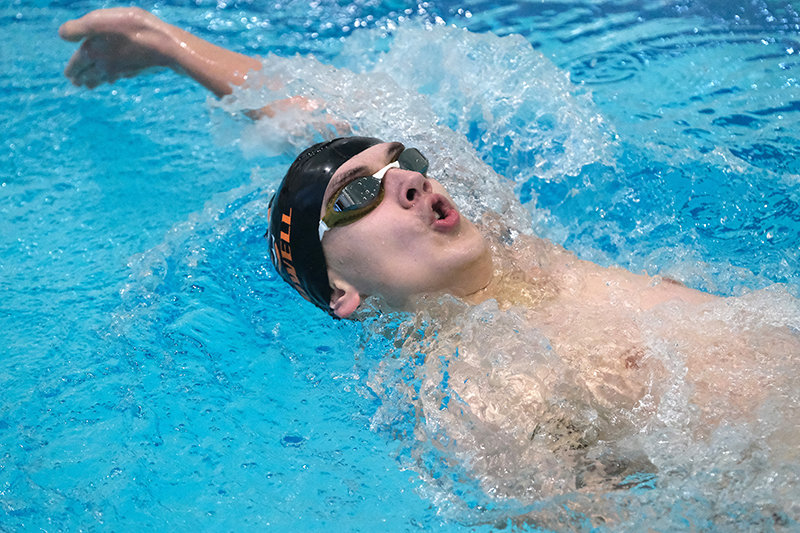 Will Fuller pushes back during the backstroke portion of the 200 IM during the Cody Triangular on Thursday.