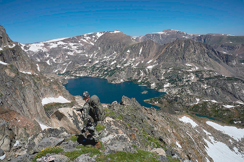 Troy Powell looks for photographs near Glacier Lake. He passes on photo opportunities in Yellowstone National Park for the most part, preferring to be alone in the wilderness to create his art and document wildlife.